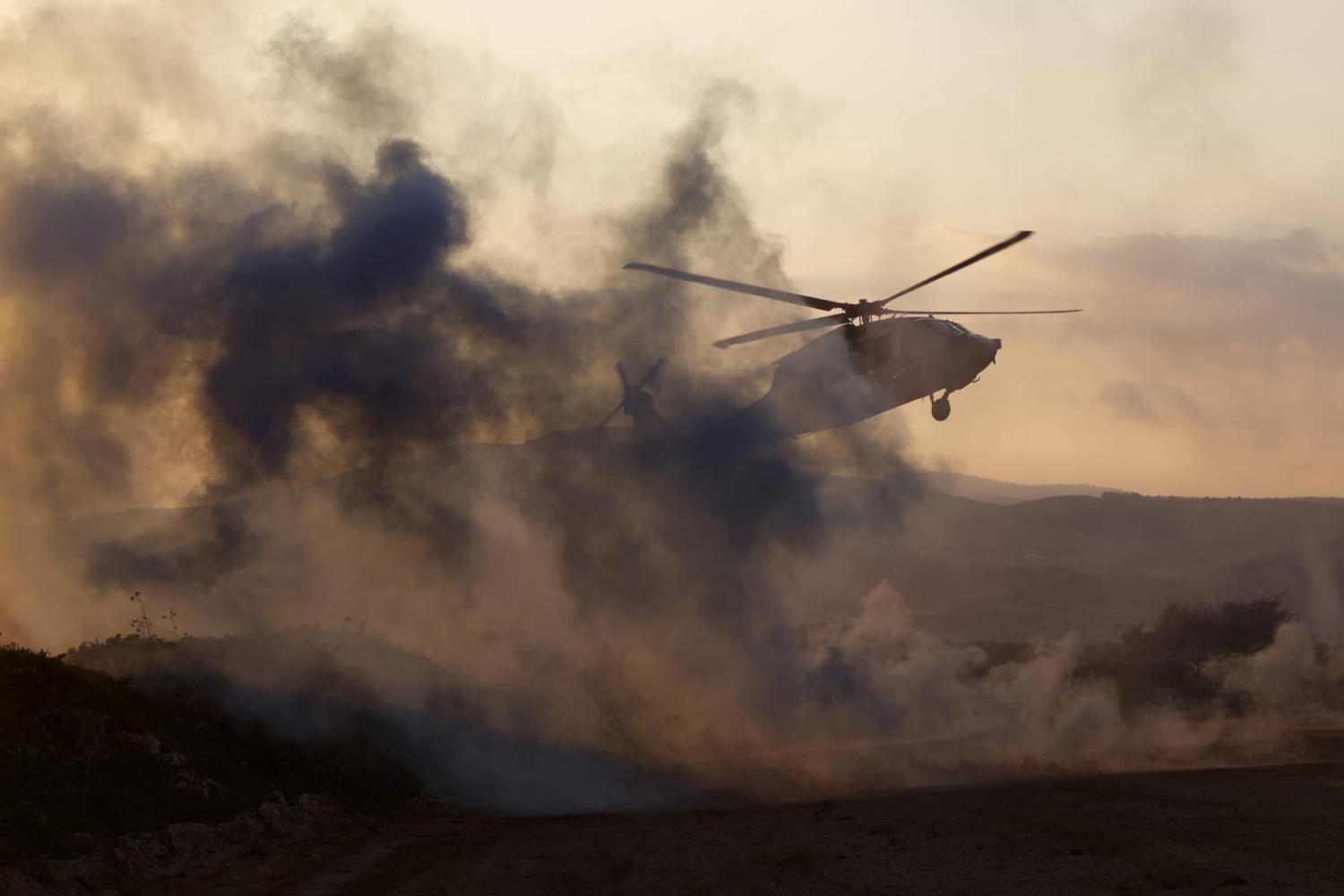 An Israeli helicopter takes off during a military exercise in Upper Galilee near the Lebanon border on 7 February, amid ongoing battles between Israel and Palestinian Hamas militants in the Gaza Strip (Jalaa Marey/AFP via Getty Images)