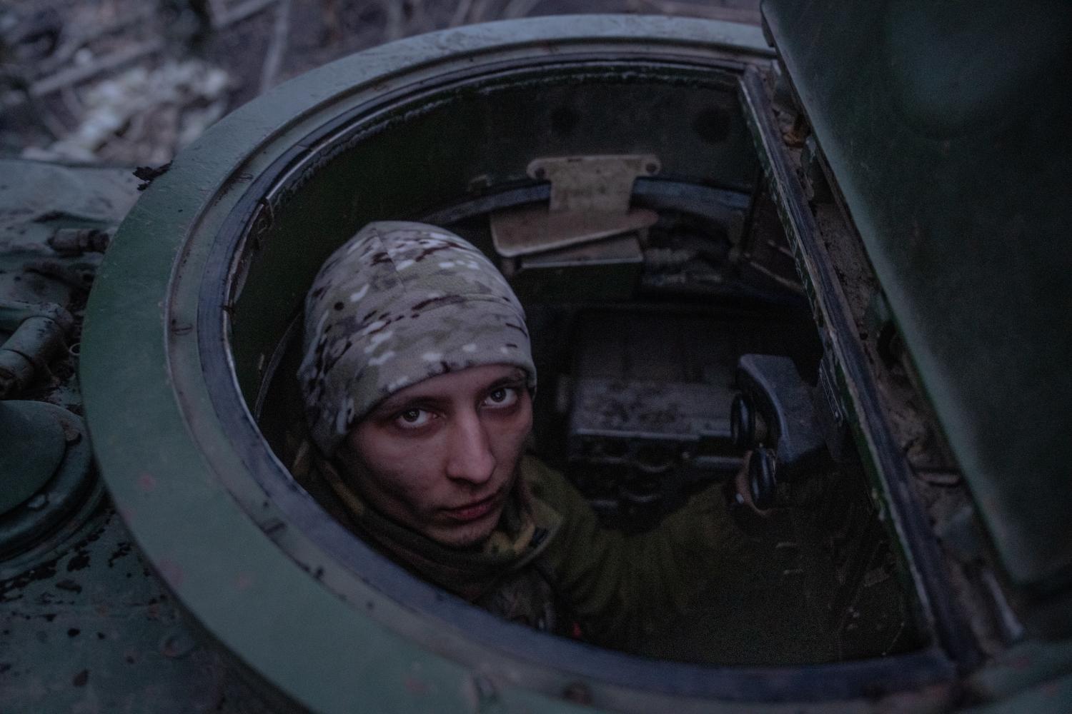 Ukrainian soldiers of the 80th brigade move along the front line towards an artillery position in the direction of Bakhmut, 5 March 2024 (Wolfgang Schwan/Getty)