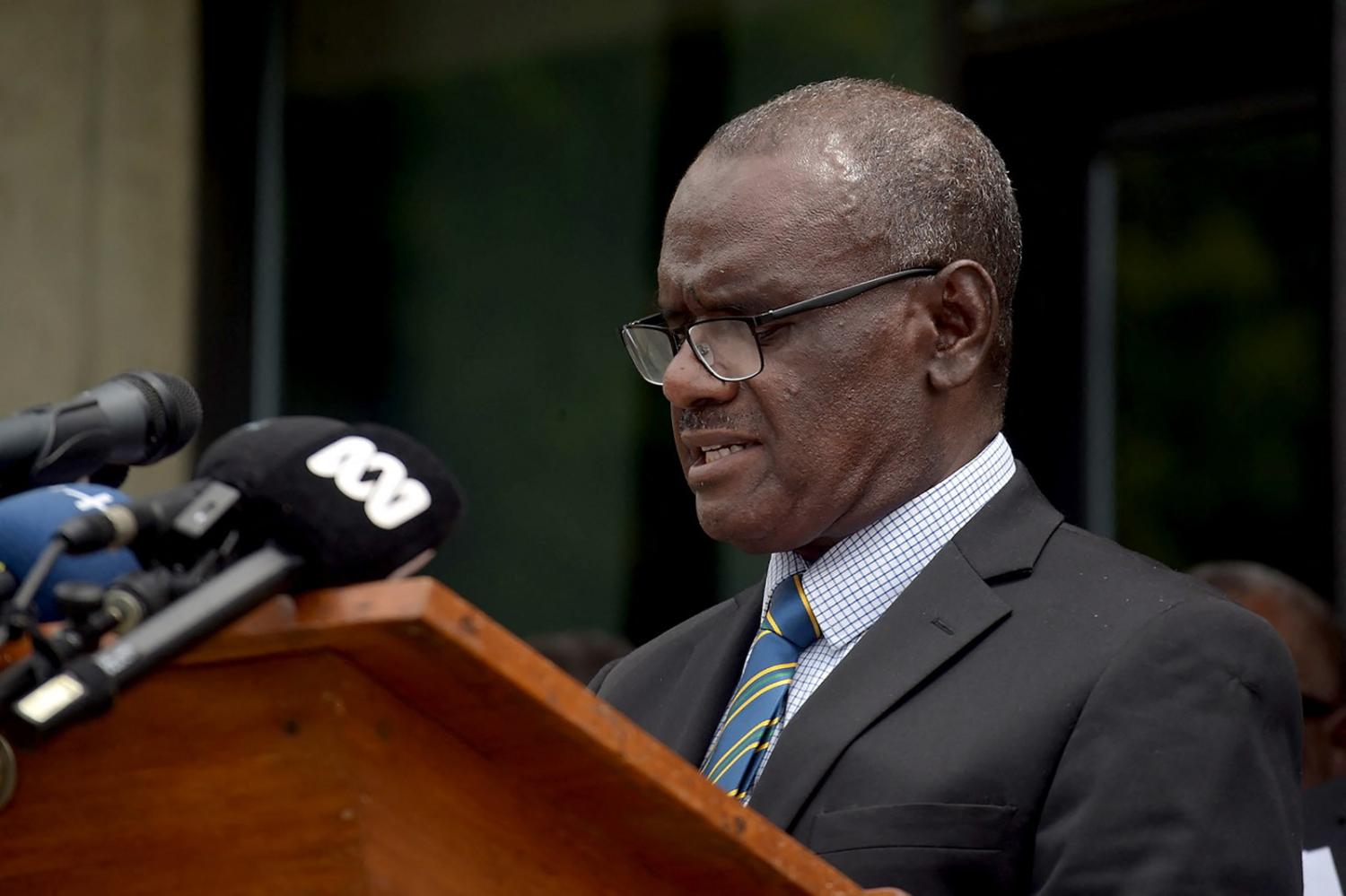 Solomon Islands' newly elected Prime Minister Jeremiah Manele speaks during a press conference outside the Parliament House in Honiara on 2 May (Alarics Fugui/AFP via Getty Images)